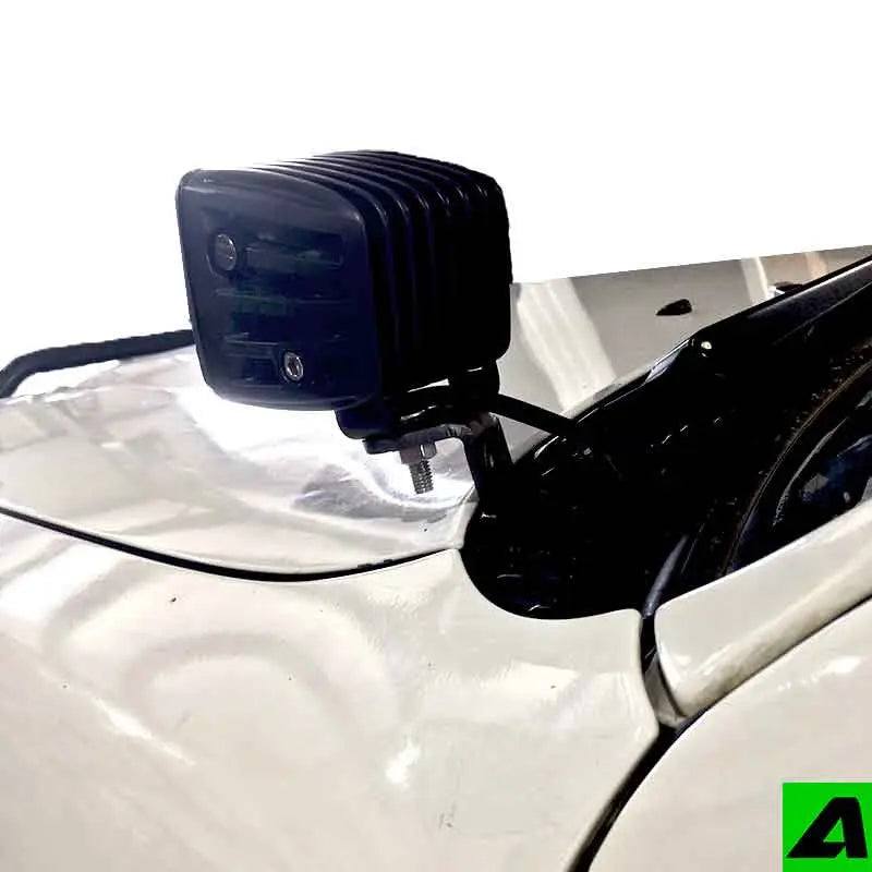 1995-2004 Toyota Tacoma with black powder-coated steel hood ditch light mounts installed on hood hinges